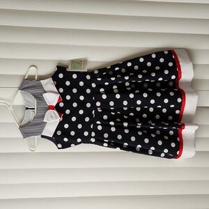 Girl's white and blue polk dot dress.
